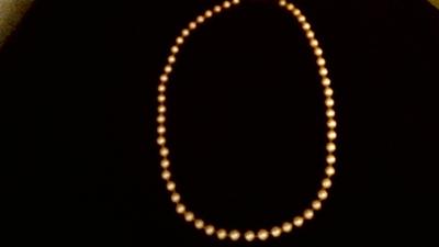 The string on mother's pearls The string on mother's pearls