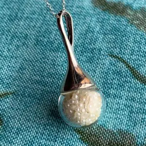 Basra Natural Pearls in Globe on Chain 2 carat total