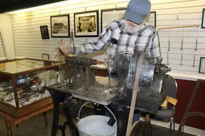 Jim Slater gave a demonstration at the Hunold Heritage Center in Montrose of a button machine  Joe Benedict/editordgc@dailygate.com