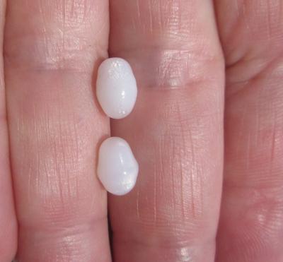 2 Flame Filled Clam Pearls 4+ carats - Total 8mm