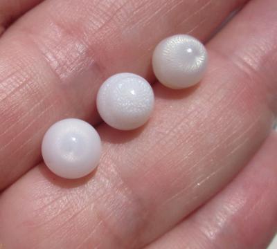 3 Off Round Clam Pearls with Flame 8 Carats Total