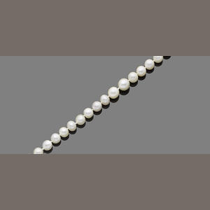A single-strand natural pearl necklace with diamond-set clasp