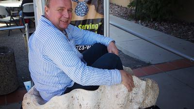 Volker Bassen sitting in giant clam shell