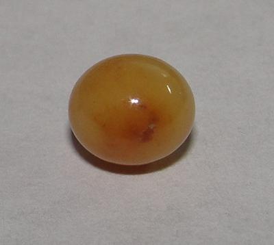 Brown Conch Pearl 2 carats Near Round