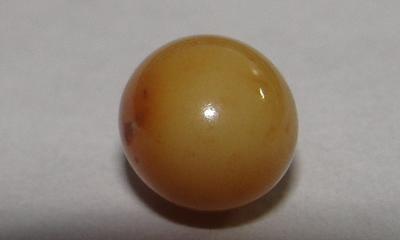 Brown Conch Pearl 2 carats Near Round