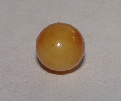Brown Conch Pearl 2 carats Near Round