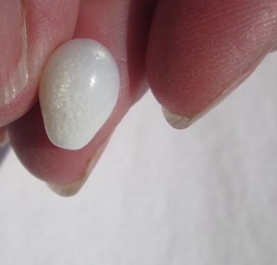 Clam Pearl Egg Shaped 4 carats 11mm with Flame
