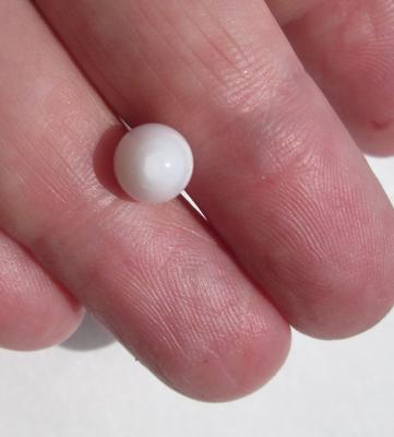 Egg Shaped Clam Pearl 9mm 3+ carats with Flame