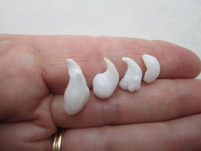 Four Curly Natural Clam Pearls 16 carats Total