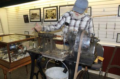 Jim Slater gave a demonstration at the Hunold Heritage Center in Montrose of a button machine  Joe Benedict/editordgc@dailygate.com