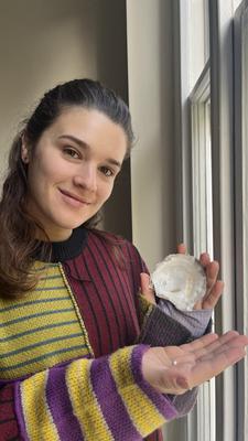 Emiliana Ammirata with the pearl she found in an oyster bought from Pinney's of Orford (Image: Joe Beveridge)