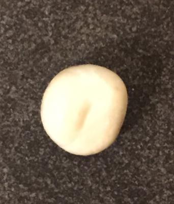 Creamy white about the size of a pea