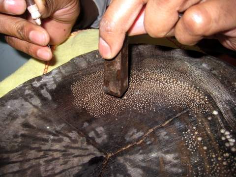 Pounding Seed Pearl into Coconut Wood