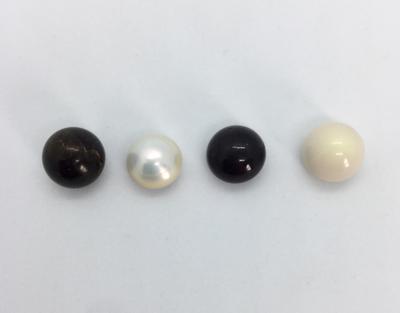 Need a nice size 10-11mm round button natural pearl? I might just have one for you. Left to right: Pen, USA freshwater, Dark purple quahog, White quahog.