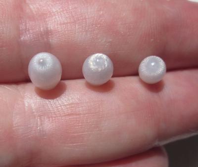 Three Flame Filled Clam Pearls 5+ carats Total Oval Shape