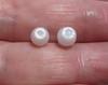 2 Flame Filled Clam Pearls 4+ carats - Total 8mm