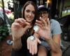 Lisa McGrath, right, and her daughter, Lindsey, discovered two pearls in a quahog while they were raking for the shellfish in Buzzards Bay.