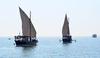 Dhow boats carrying divers attend the inauguration of the 32nd Pearl Diving Festival Kuwait (Photo by Asad/Xinhua)