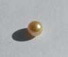 Rare round golden natural pearl