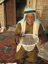 Merchant in UAE demonstrates nose clip & basket for pearl gathering PHOTO by Kari