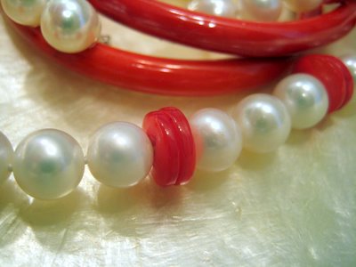 Closeup White Pearls Red Buttons