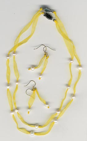 yellow ribbon and pearl necklace and earrings